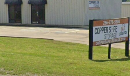 Copper Safe Storage facility office with sign in front.