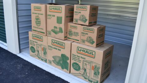 View of storage boxes placed in storage unit at Olympia Extra Storage facility.
