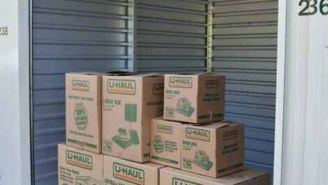 View of storage boxes placed in storage unit at Olympia Extra Storage facility.
