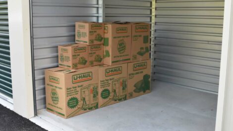 View of storage boxes placed in storage unit at Olympia Extra Storage facility.