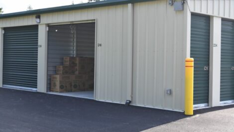 View of storage boxes placed in storage unit at Olympia Extra Storage facility.