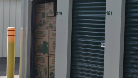 View of storage boxes placed in storage unit at Olympia Extra Storage facility.
