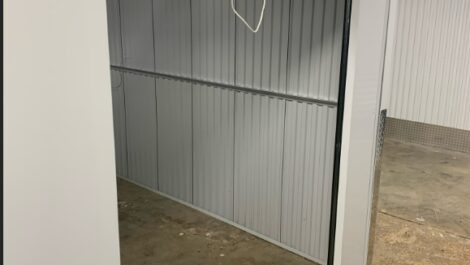 Indoor storage unit with door open.