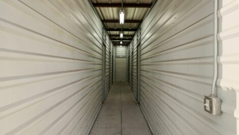 Hallway view of indoor personal storage units.