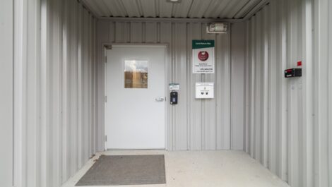 Entrance door to security building with key code.