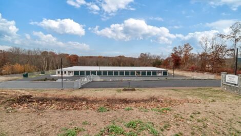 Aerial view of the front of storage facility with gated security.