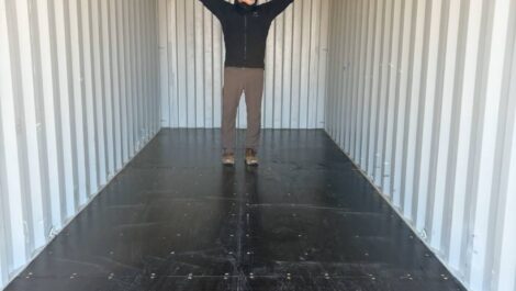 Person standing in storage unit to show size.
