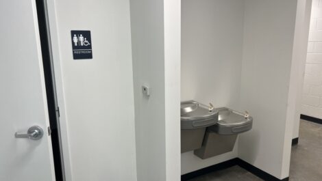 View of bathroom and water fountain at State College Storage.
